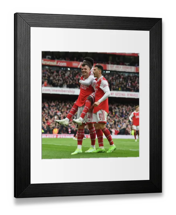 Framed Print : Arsenal's Triumphant Trio: Xhaka, Saka, and Martinelli's Euphoric Goal Celebration (2022-23): A Peak at Arsenal FC's Exhilarating Victory over Leeds United