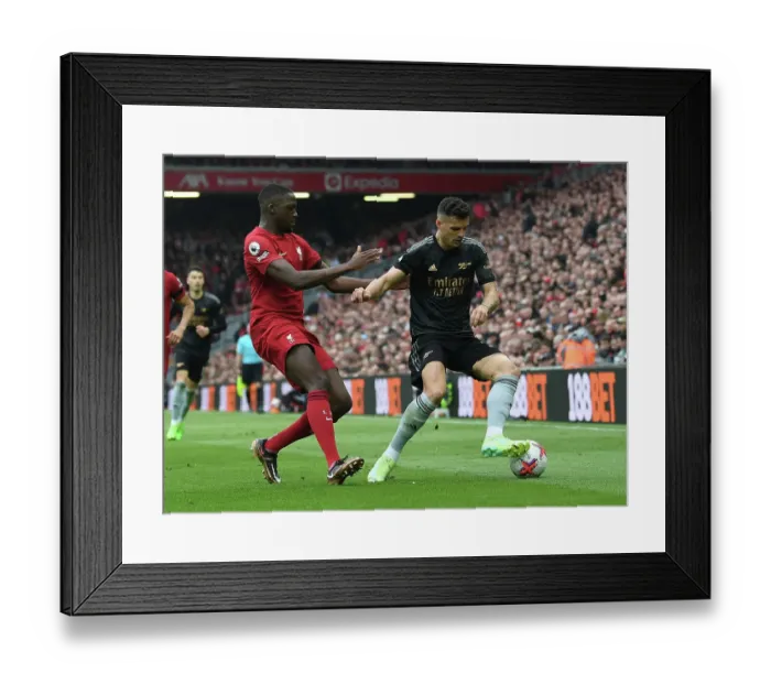 Framed Print : Xhaka vs Konate: A Premier League Battle at Anfield (2022-23) Framed Print : Xhaka vs Konate: A Premier League Battle at Anfield (2022-23)