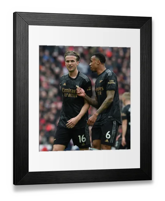 Framed Print : Arsenal's Holding and Gabriel Clash in Intense Rivalry: Liverpool vs. Arsenal (2022-23)