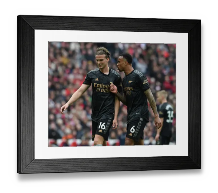 Framed Print : Arsenal's Holding and Gabriel Face Off Against Liverpool at Anfield (2022-23) Framed Print : Arsenal's Holding and Gabriel Face Off Against Liverpool at Anfield (2022-23)