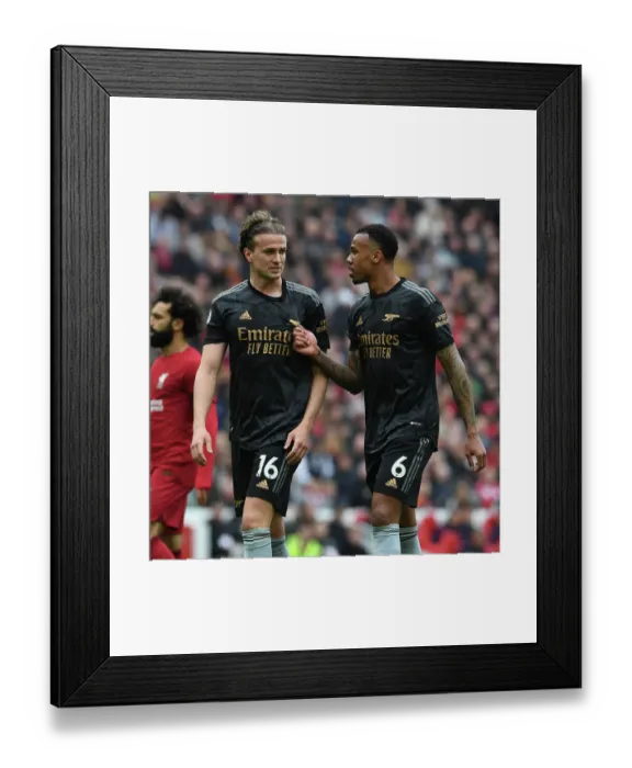 Framed Print : Arsenal's Defensive Showdown: Holding vs. Gabriel at Anfield (2022-23)