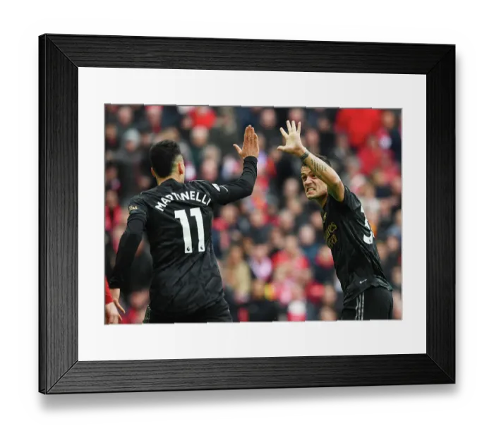 Framed Print : Xhaka and Martinelli Celebrate Arsenal's Victory over Liverpool in the 2022-23 Premier League