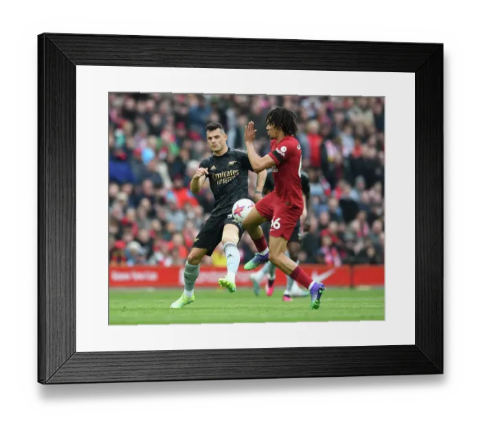 Framed Print : Clash of Midfield Titans: Xhaka vs. Alexander-Arnold - Liverpool's Trent vs. Arsenal's Granit