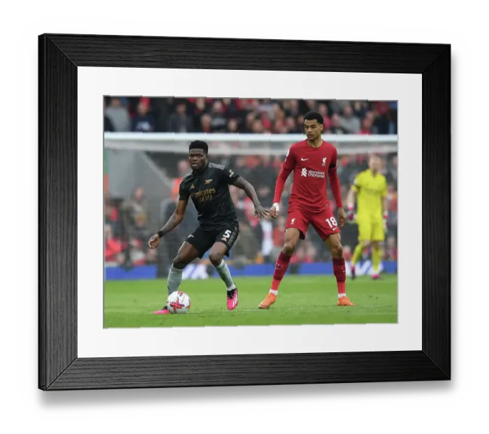 Framed Print : Thomas Partey vs. Cody Gakpo: A Premier League Battle at Anfield