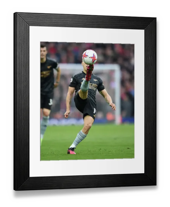 Framed Print : Arsenal's Trossard Faces Off Against Liverpool in Premier League Clash
