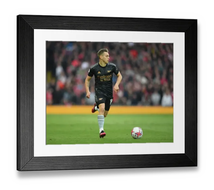 Framed Print : Arsenal's Trossard Goes Head-to-Head with Liverpool in Intense Premier League Clash