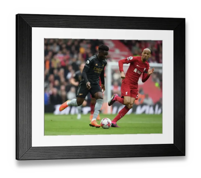 Framed Print : Bukayo Saka vs Fabinho: Intense Battle at Anfield - Liverpool vs Arsenal, Premier League 2022-23