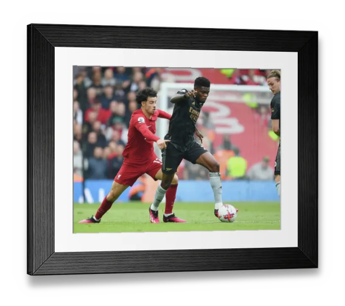 Framed Print : Thomas Partey vs. Curtis Jones: Intense Rivalry at Anfield - Arsenal vs. Liverpool, Premier League 2022-23