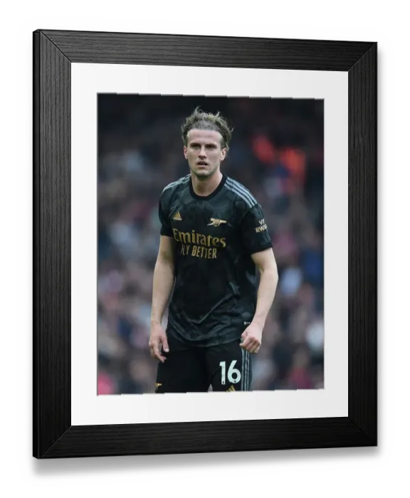 Framed Print : Rob Holding's Unyielding Display: Arsenal Stands Firm Against Liverpool in Premier League Battle
