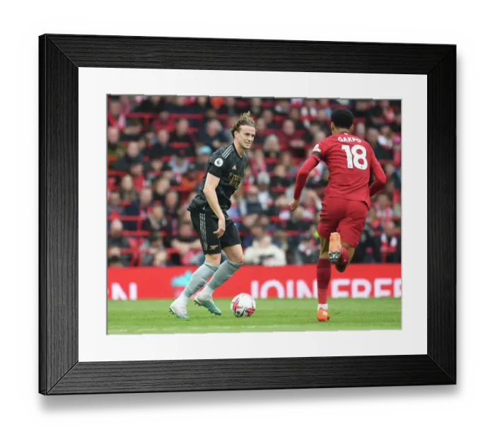 Framed Print : Rob Holding's Defiant Display: Arsenal Stands Strong Against Liverpool in the 2022-23 Premier League Battle