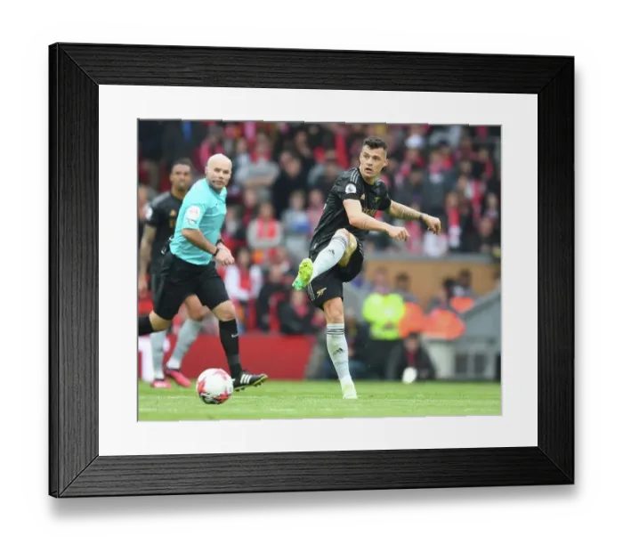 Framed Print : Granit Xhaka of Arsenal Faces Off Against Liverpool FC in the Premier League