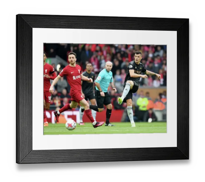 Framed Print : Granit Xhaka in Action: Premier League Showdown at Anfield - Passing the Ball, Liverpool vs. Arsenal, 2022-23