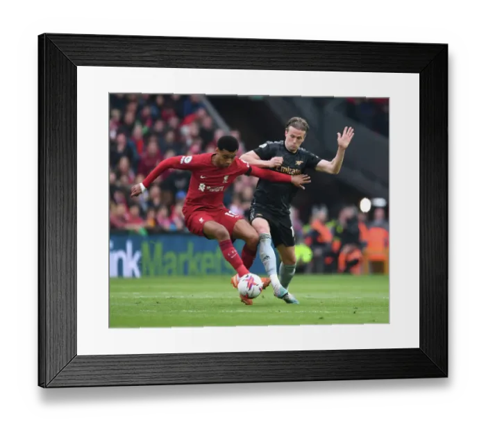 Framed Print : Arsenal's Rob Holding Faces Off Against Liverpool in Premier League Showdown Framed Print : Arsenal's Rob Holding Faces Off Against Liverpool in Premier League Showdown