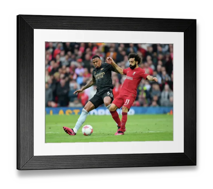 Framed Print : Mohamed Salah vs. Gabriel: Intense Rivalry at Anfield - Liverpool vs. Arsenal, Premier League 2022-23 Framed Print : Mohamed Salah vs. Gabriel: Intense Rivalry at Anfield - Liverpool vs. Arsenal, Premier League 2022-23