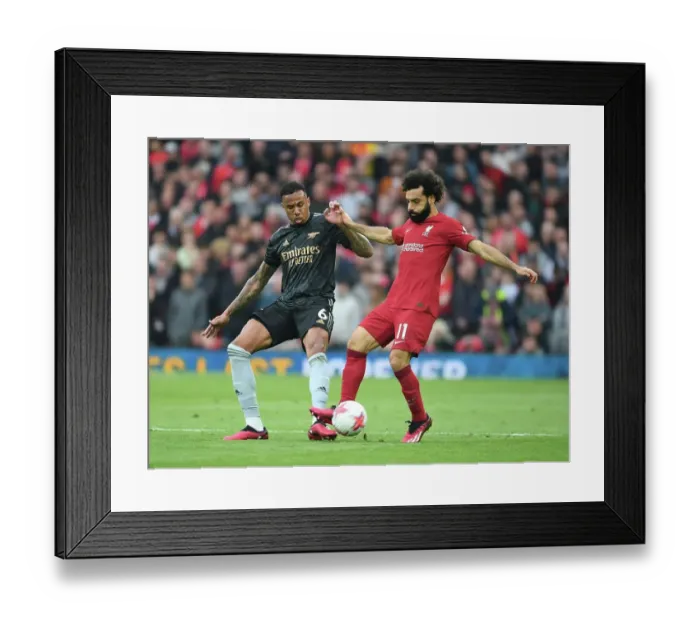 Framed Print : Gabriel vs. Salah: Intense Rivalry at Anfield - Liverpool vs. Arsenal, Premier League 2022-23