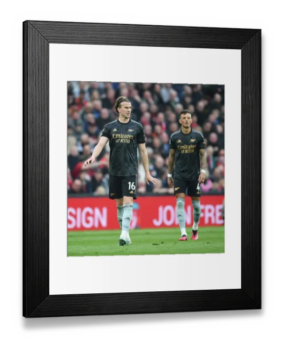 Framed Print : Rob Holding's Defiant Performance: Arsenal's Gritty Stand against Liverpool in Premier League Showdown