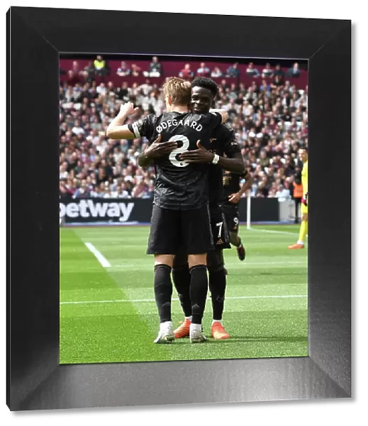 Arsenal's Martin Odegaard and Bukayo Saka Celebrate Second Goal vs. West Ham United (April 2023)