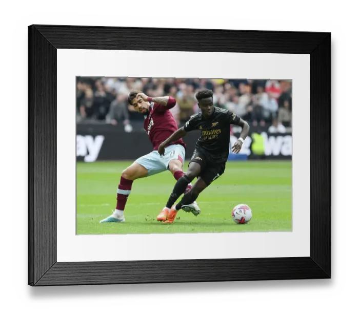 Framed Print : Clash of Titans: Bukayo Saka vs. Lucas Paqueta - West Ham United vs. Arsenal FC, Premier League 2022-23