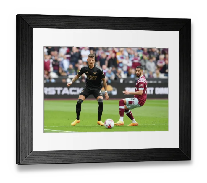 Framed Print : Arsenal's Ben White Faces Off Against West Ham's Said Benrahma in Premier League Clash