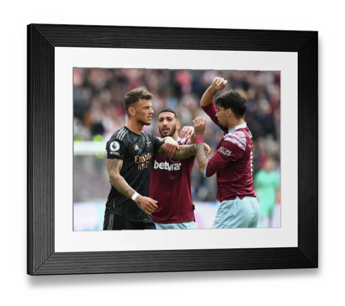 Framed Print : Clash of Titans: Ben White Faces Off Against West Ham's Said Benrahma and Lucas Paqueta in the Premier League Showdown