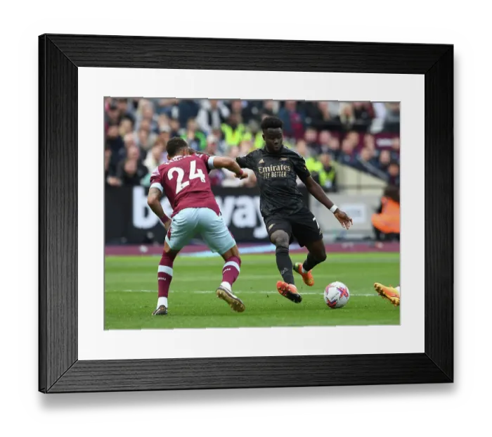 Framed Print : Bukayo Saka Faces Off Against Thilo Kehrer: Intense Moment from West Ham vs. Arsenal Premier League Clash (2022-23) Framed Print : Bukayo Saka Faces Off Against Thilo Kehrer: Intense Moment from West Ham vs. Arsenal Premier League Clash (2022-23)