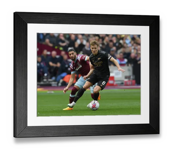 Framed Print : Martin Odegaard vs Said Benrahma: Intense Battle in West Ham United vs Arsenal FC Premier League Clash, London 2023