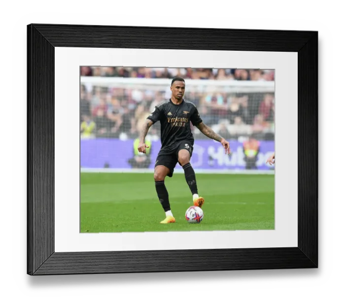 Framed Print : Gabriel Magalhaes Focuses in Arsenal's Battle at London Stadium: West Ham United vs Arsenal FC, Premier League 2022-23