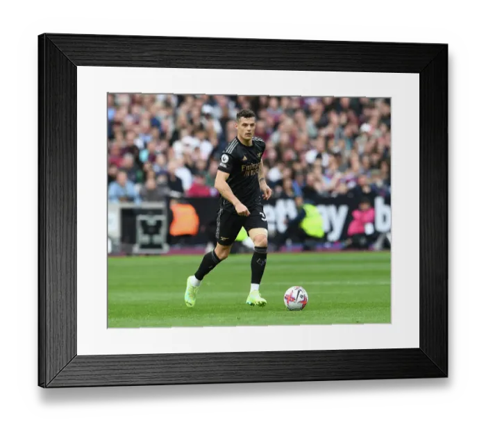 Framed Print : Granit Xhaka: Arsenal's Brilliant Midfield Performance Against West Ham United in Premier League