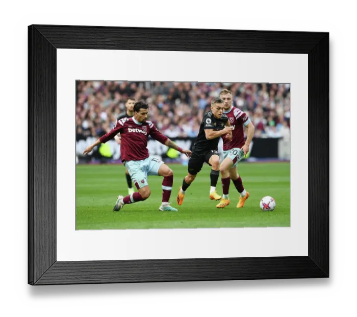 Framed Print : Clash at London Stadium: Arsenal's Trossard Faces Off Against West Ham's Paqueta and Bowen