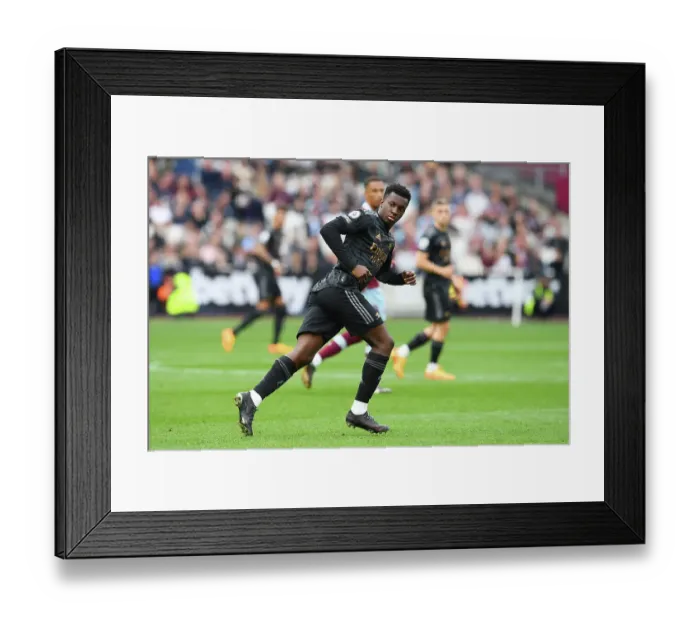 Framed Print : Arsenal's Eddie Nketiah Focuses Ahead Amidst West Ham Battle (Premier League 2022-23) Framed Print : Arsenal's Eddie Nketiah Focuses Ahead Amidst West Ham Battle (Premier League 2022-23)