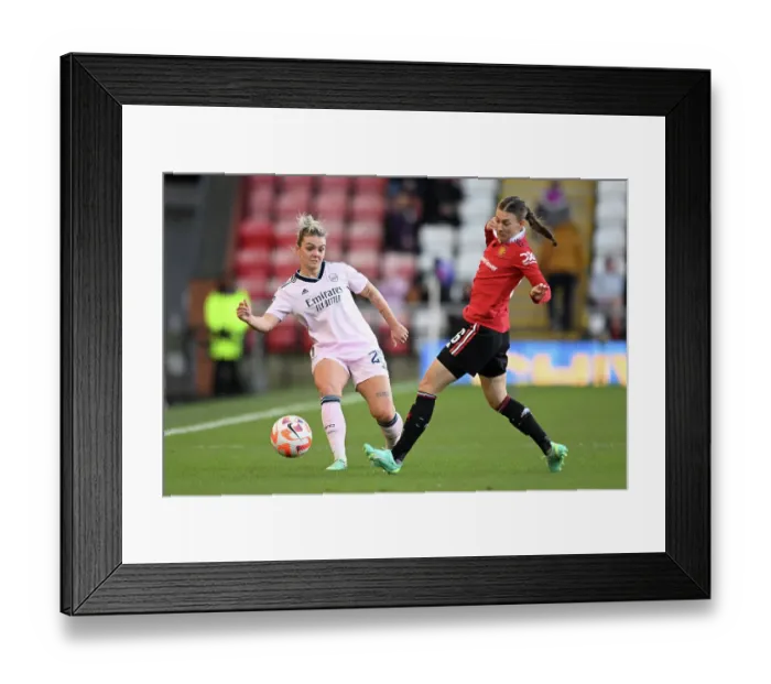 Framed Print : Manchester United vs. Arsenal: Women's Super League Clash - Arsenal's Laura Wienroither Fends Off Hannah Blundell Framed Print : Manchester United vs. Arsenal: Women's Super League Clash - Arsenal's Laura Wienroither Fends Off Hannah Blundell