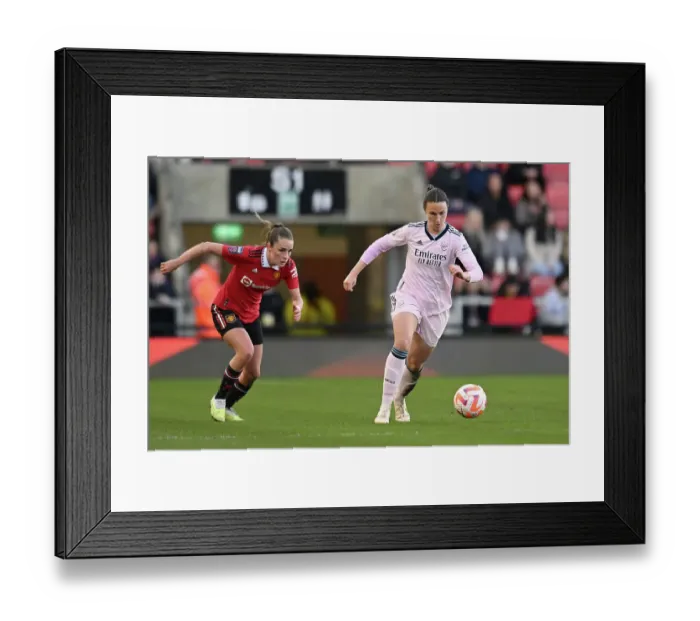 Framed Print : Arsenal's Lotte Wubben-Moy Fends Off Manchester United's Ella Toone in FA Women's Super League Clash Framed Print : Arsenal's Lotte Wubben-Moy Fends Off Manchester United's Ella Toone in FA Women's Super League Clash