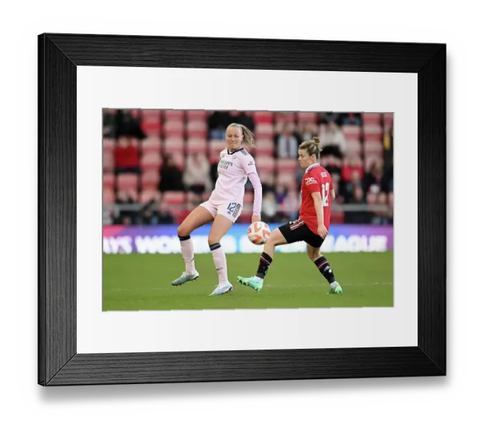 Framed Print : Arsenal's Frida Maanum Faces Pressure from Manchester United's Hayley Ladd in FA Women's Super League Clash Framed Print : Arsenal's Frida Maanum Faces Pressure from Manchester United's Hayley Ladd in FA Women's Super League Clash