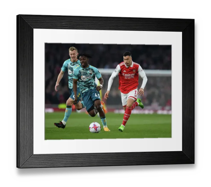 Framed Print : Arsenal's Martinelli Clashes with Southampton's Lavia in Premier League Showdown