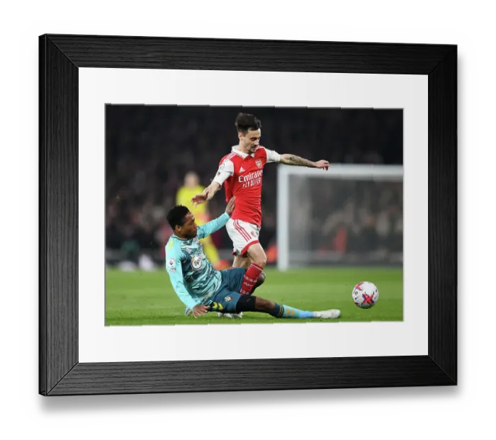 Framed Print : Arsenal vs. Southampton: Fabio Vieira Tackled by Kyle Walker-Peters in Intense Premier League Clash (2022-23)