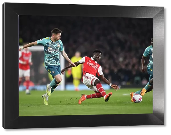 Arsenal vs Southampton: Bukayo Saka Fights for Possession in the Premier League