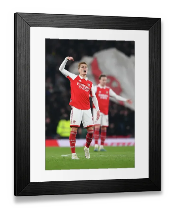 Framed Print : Arsenal's Martin Odegaard Rallies Fans Amidst Arsenal FC vs Southampton FC Tussle, Premier League 2022-23