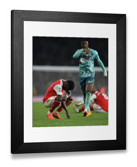 Framed Print : Arsenal's Bukayo Saka Celebrates Victory Over Southampton in 2022-23 Premier League Framed Print : Arsenal's Bukayo Saka Celebrates Victory Over Southampton in 2022-23 Premier League