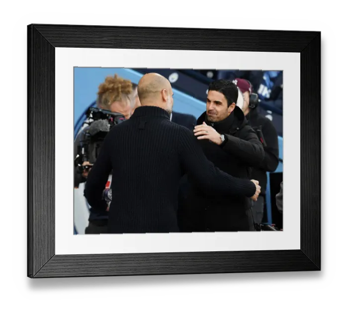 Framed Print : Manchester Rivalry: Mikel Arteta and Pep Guardiola Embrace Before Arsenal-Man City Clash (2022-23)