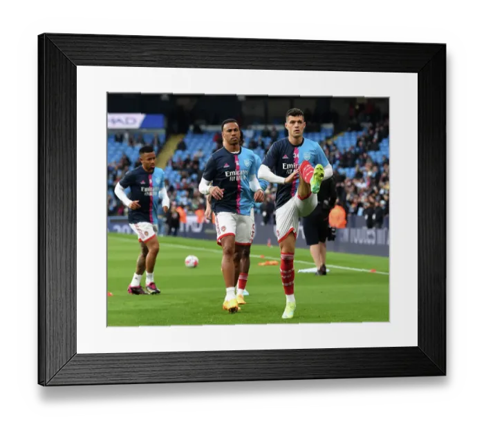 Framed Print : Arsenal's Gabriel and Xhaka Warm Up Ahead of Manchester City Showdown - Premier League 2022-23
