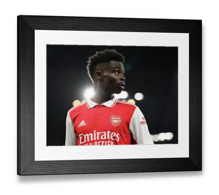 Framed Print : Bukayo Saka in Action: A Riveting Moment from Manchester City vs. Arsenal, Premier League 2022-23