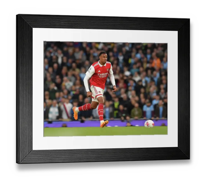Framed Print : MANCHESTER, ENGLAND - APRIL 26: Gabriel Magalhaes of Arsenal during the Premier League match between Manchester City and Arsenal FC at Etihad Stadium on April 26, 2023 in Manchester, England. (Photo by David Price / Arsenal FC via Getty Images)