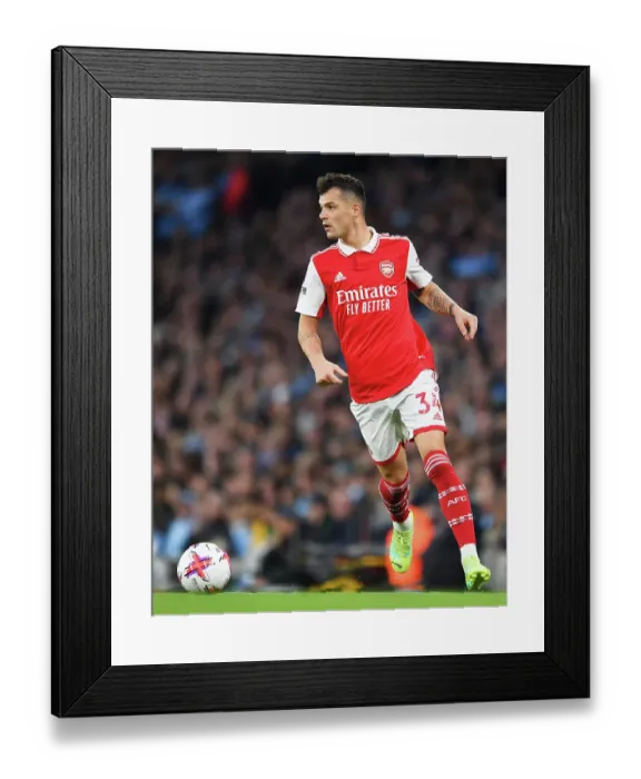 Framed Print : Granit Xhaka Charges Forward: Manchester City vs. Arsenal, Premier League 2022-23 Framed Print : Granit Xhaka Charges Forward: Manchester City vs. Arsenal, Premier League 2022-23