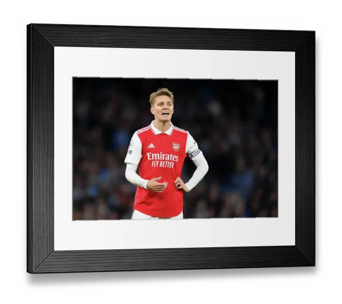 Framed Print : Arsenal's Martin Odegaard Reacts During Manchester City vs Arsenal Premier League Clash (2022-23) Framed Print : Arsenal's Martin Odegaard Reacts During Manchester City vs Arsenal Premier League Clash (2022-23)