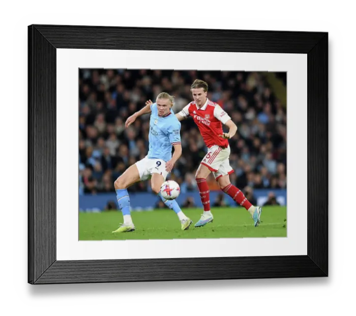 Framed Print : Haaland vs. Holding: Battle for Possession in Manchester City vs. Arsenal Premier League Clash (2022-23) Framed Print : Haaland vs. Holding: Battle for Possession in Manchester City vs. Arsenal Premier League Clash (2022-23)