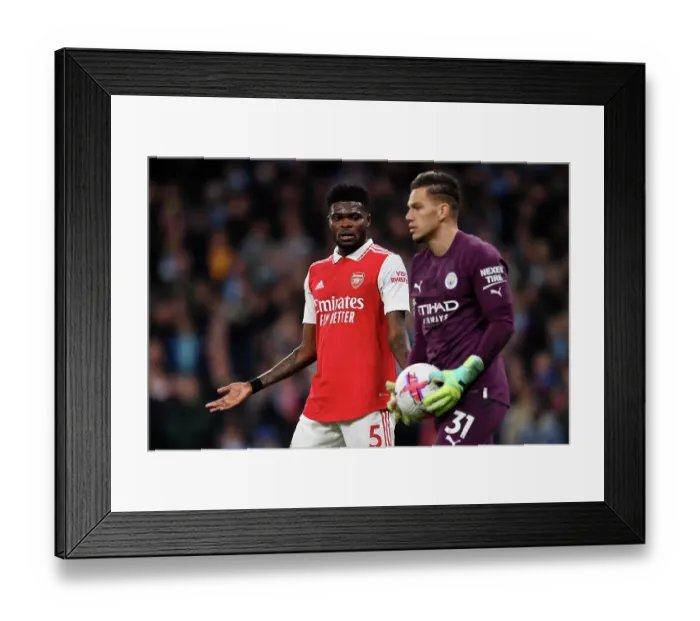 Framed Print : Thomas Partey vs. Ederson: Intense Rivalry in Manchester City vs. Arsenal FC Premier League Clash (2022-23)