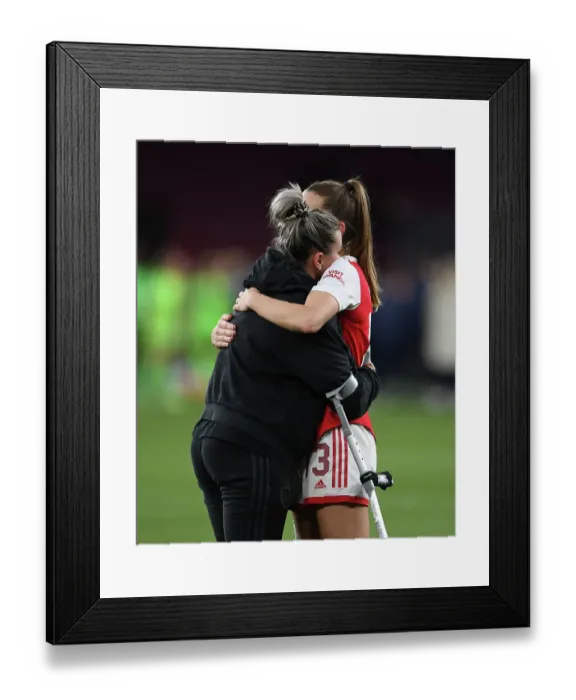 Framed Print : Arsenal Women's Heartbreak: Laura Wienroither Consoled by Lia Walti After Semifinal Defeat to VfL Wolfsburg Framed Print : Arsenal Women's Heartbreak: Laura Wienroither Consoled by Lia Walti After Semifinal Defeat to VfL Wolfsburg