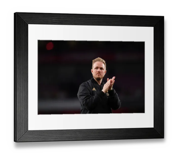 Framed Print : Arsenal Women's Historic Champions League Victory: Jonas Eidevall Celebrates with Fans at Emirates Stadium Framed Print : Arsenal Women's Historic Champions League Victory: Jonas Eidevall Celebrates with Fans at Emirates Stadium