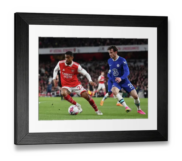 Framed Print : Arsenal's Reiss Nelson Faces Off Against Chelsea's Ben Chilwell in Intense Premier League Clash Framed Print : Arsenal's Reiss Nelson Faces Off Against Chelsea's Ben Chilwell in Intense Premier League Clash