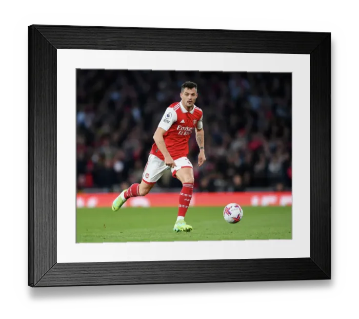 Framed Print : Arsenal's Granit Xhaka Charges Forward in Arsenal FC vs Chelsea FC Premier League Clash (2022-23)